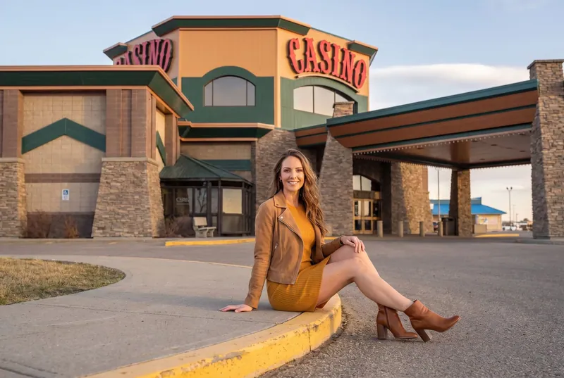 Visitor sitting on the curb by the casino entrance
